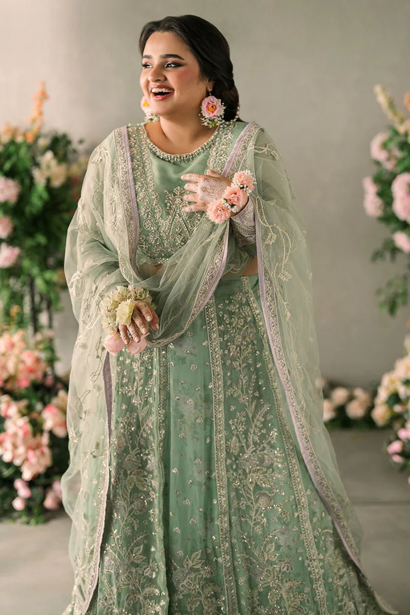 Model wearing Mushq Mastani Evening Luxury Chiffon Faiza dress in mint green with floral detailing, ideal for Pakistani wedding clothes online in the UK.