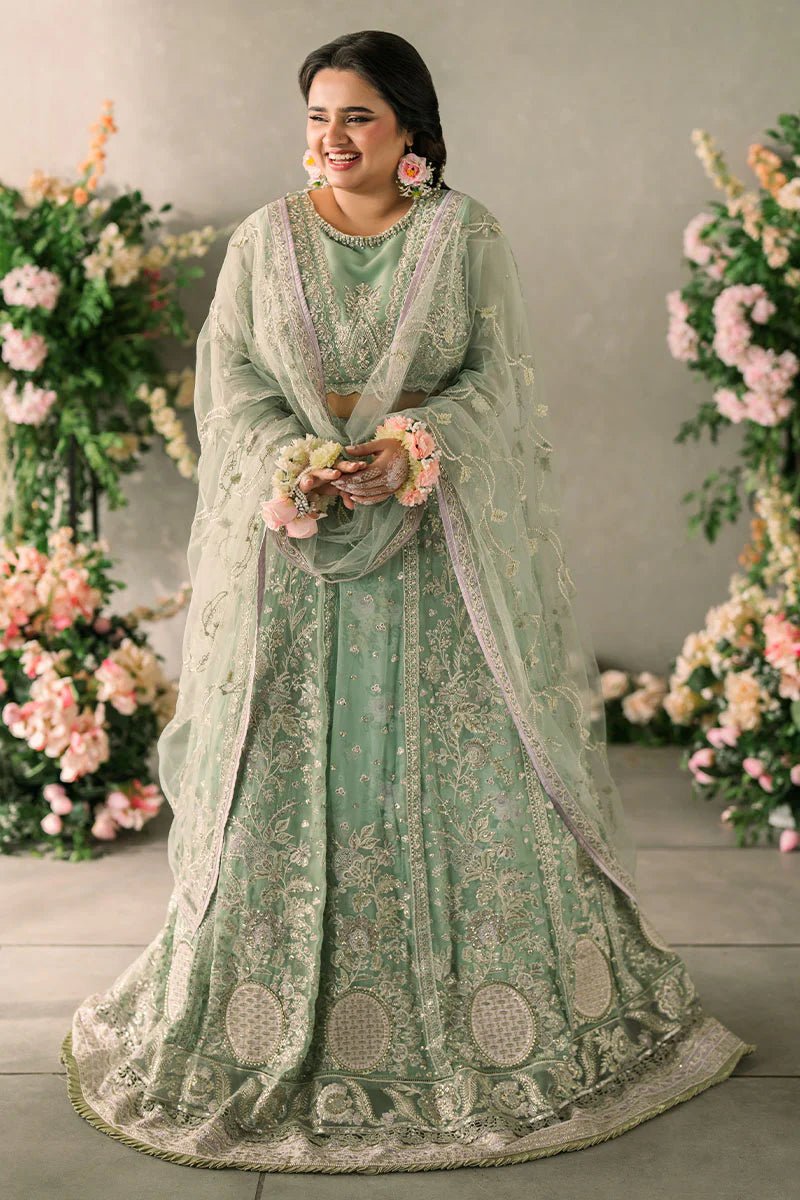 Model wearing Mushq Mastani Evening Luxury Chiffon Faiza dress in mint green with floral detailing, ideal for Pakistani wedding clothes online in the UK.