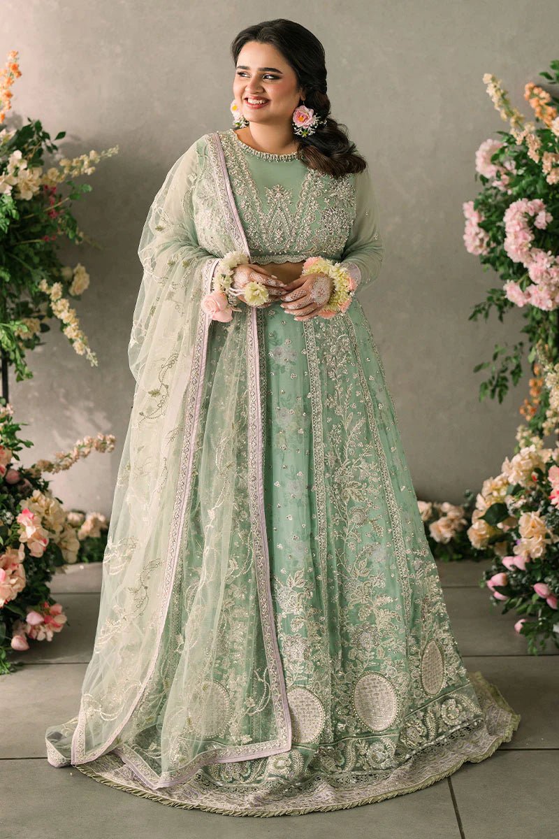 Model wearing Mushq Mastani Evening Luxury Chiffon Faiza dress in mint green with floral detailing, ideal for Pakistani wedding clothes online in the UK.