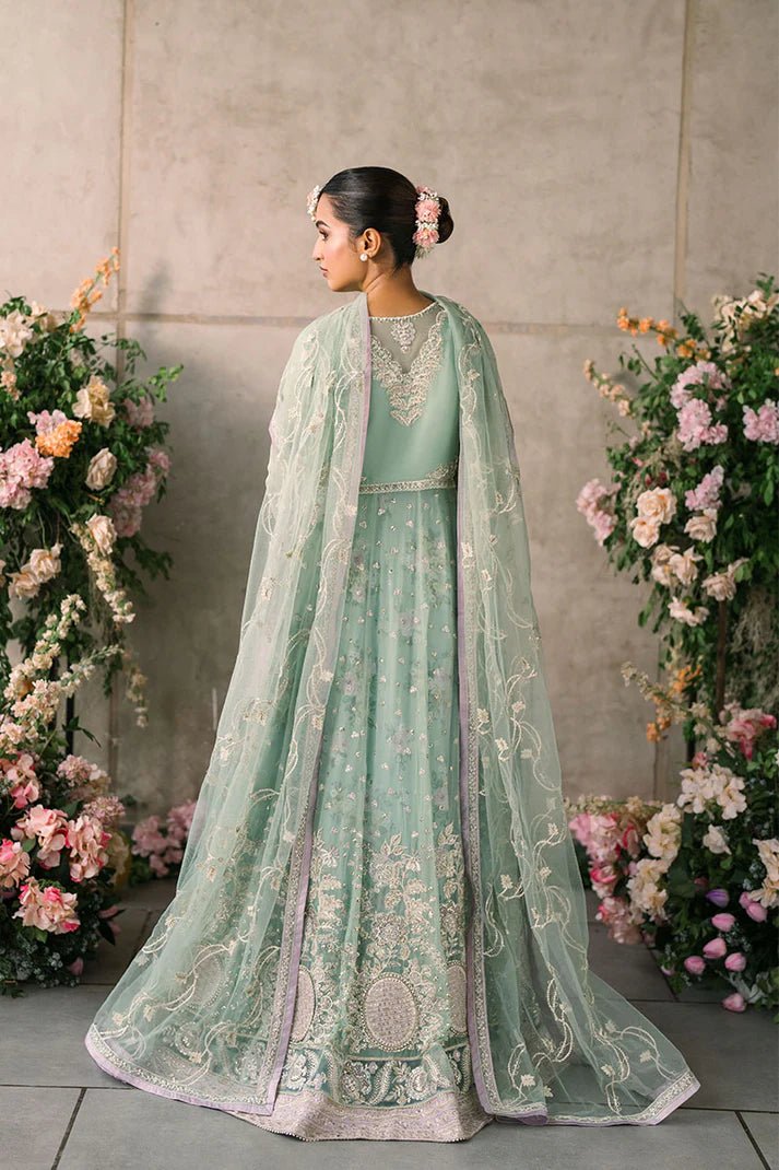 Model wearing Mushq Mastani Evening Luxury Chiffon Faiza dress in mint green with floral detailing, ideal for Pakistani wedding clothes online in the UK.