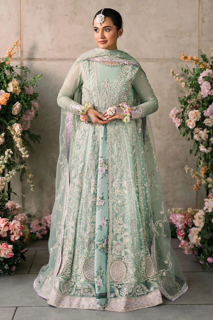 Model wearing Mushq Mastani Evening Luxury Chiffon Faiza dress in mint green with floral detailing, ideal for Pakistani wedding clothes online in the UK.