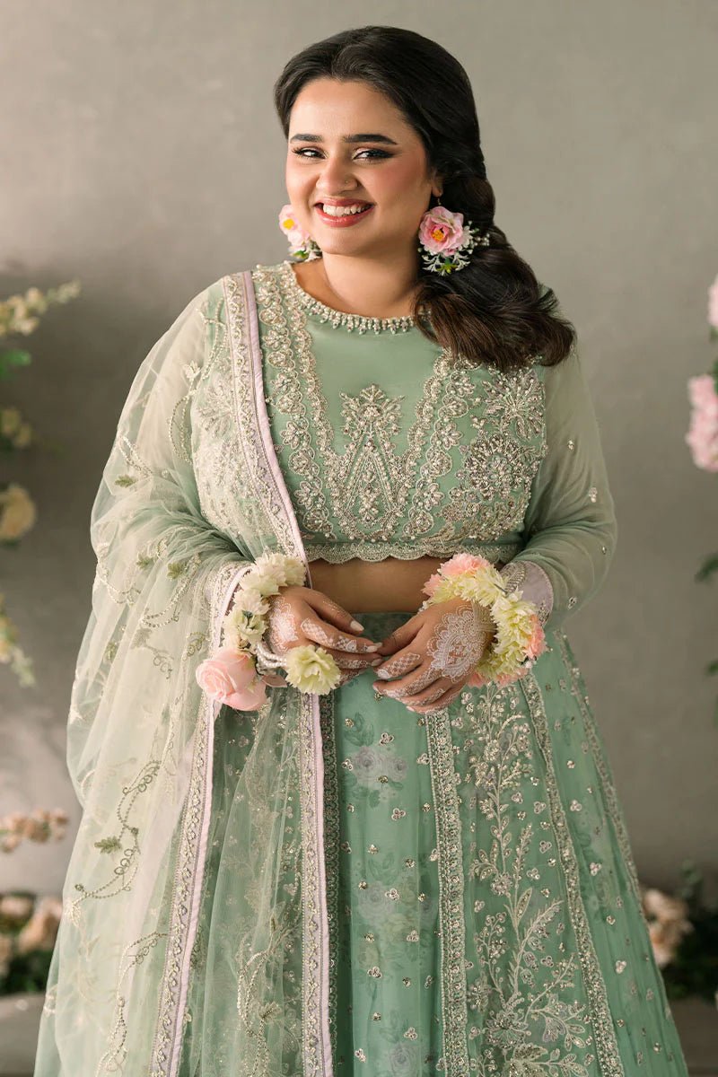 Model wearing Mushq Mastani Evening Luxury Chiffon Faiza dress in mint green with floral detailing, ideal for Pakistani wedding clothes online in the UK.