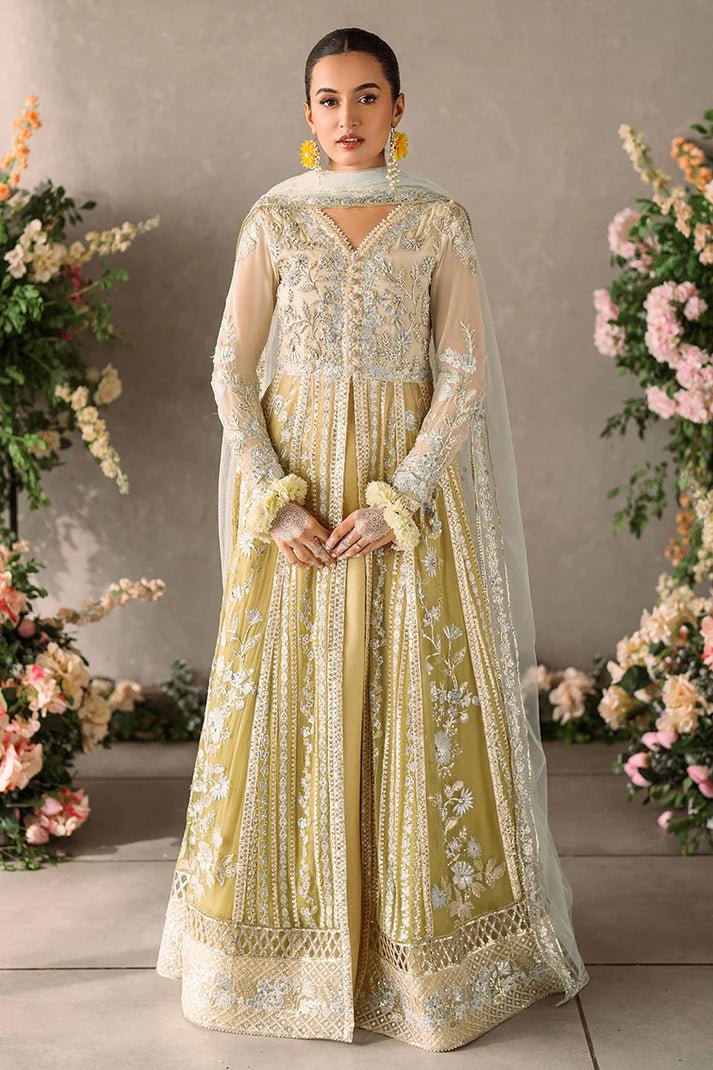 Model wearing Mushq Mastani Evening Luxury Chiffon Hira dress in pale yellow with intricate silver embroidery, ideal for Pakistani wedding clothes online in the UK.