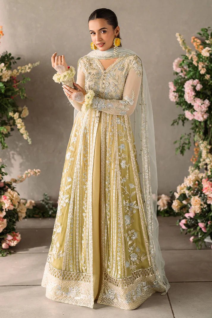 Model wearing Mushq Mastani Evening Luxury Chiffon Hira dress in pale yellow with intricate silver embroidery, ideal for Pakistani wedding clothes online in the UK.