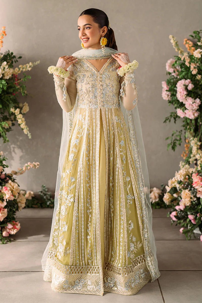 Model wearing Mushq Mastani Evening Luxury Chiffon Hira dress in pale yellow with intricate silver embroidery, ideal for Pakistani wedding clothes online in the UK.