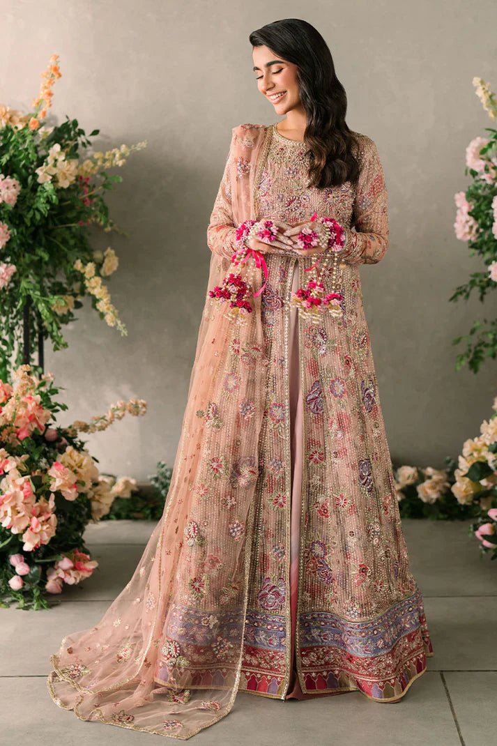 Model wearing Mushq Mastani Evening Luxury Chiffon Sona dress in peach, featuring intricate floral embroidery, ideal for Pakistani wedding clothes online in the UK.