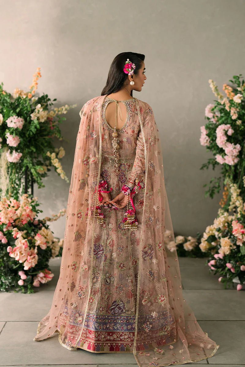 Model wearing Mushq Mastani Evening Luxury Chiffon Sona dress in peach, featuring intricate floral embroidery, ideal for Pakistani wedding clothes online in the UK.