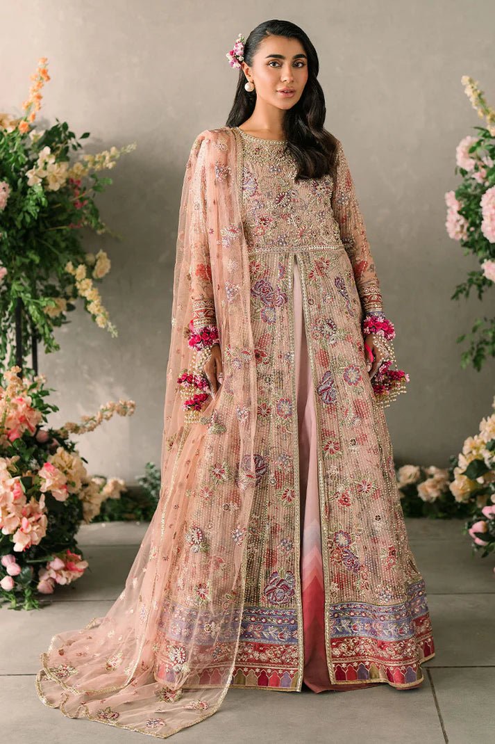 Model wearing Mushq Mastani Evening Luxury Chiffon Sona dress in peach, featuring intricate floral embroidery, ideal for Pakistani wedding clothes online in the UK.