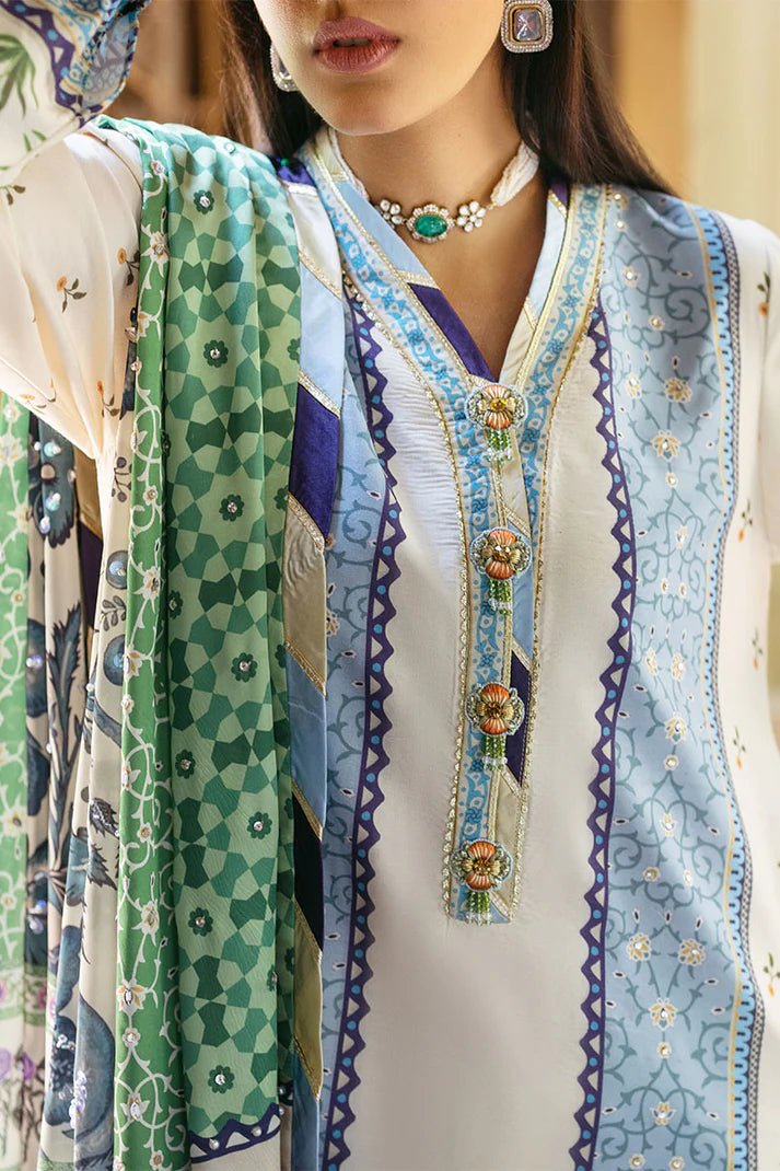 Model wearing Azure dress from Mushq's Nirvana Silk Edit, featuring intricate blue and green floral prints. Pakistani winter casual pret clothes available online in the UK.