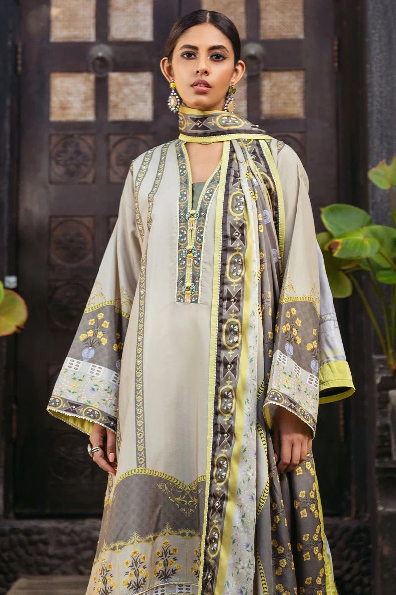 Model wearing Chestnut dress from Mushq's Nirvana Silk Edit in beige and grey tones with floral accents. Pakistani winter casual pret clothes available online in the UK.