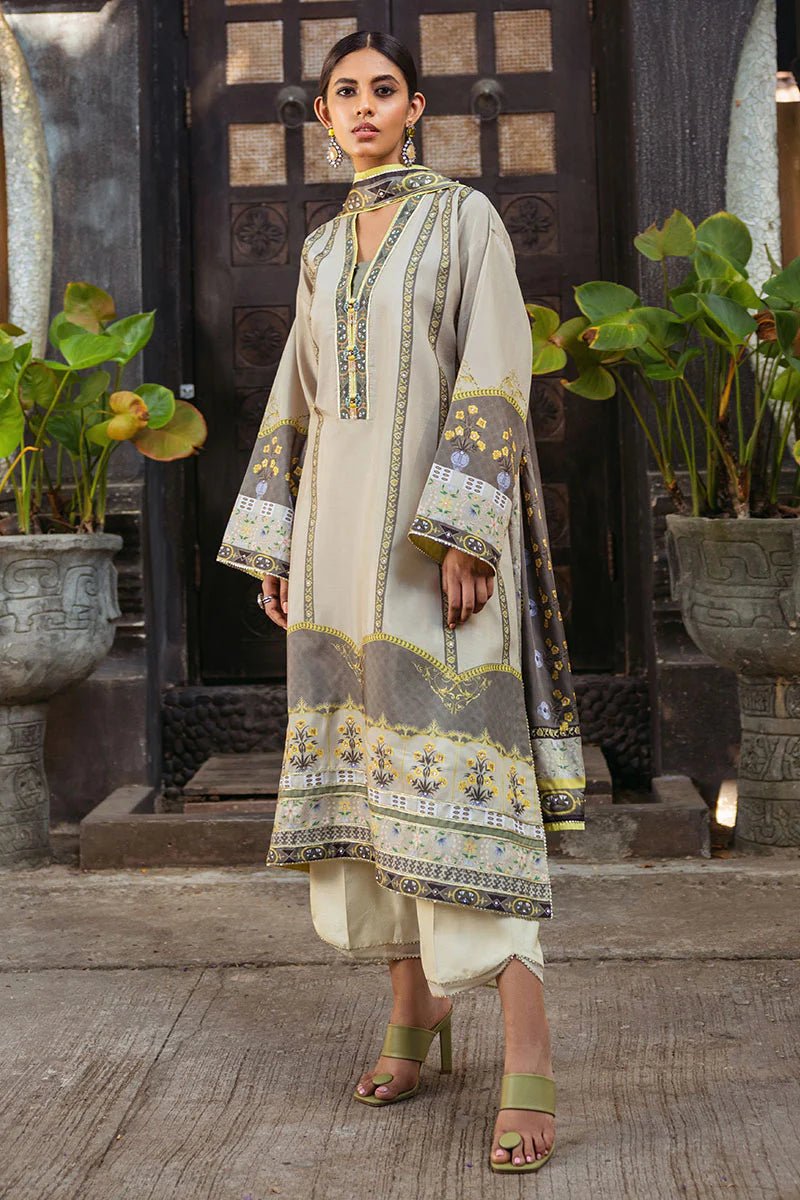 Model wearing Chestnut dress from Mushq's Nirvana Silk Edit in beige and grey tones with floral accents. Pakistani winter casual pret clothes available online in the UK.