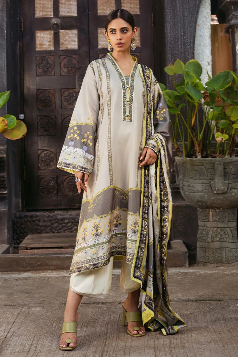 Model wearing Chestnut dress from Mushq's Nirvana Silk Edit in beige and grey tones with floral accents. Pakistani winter casual pret clothes available online in the UK.