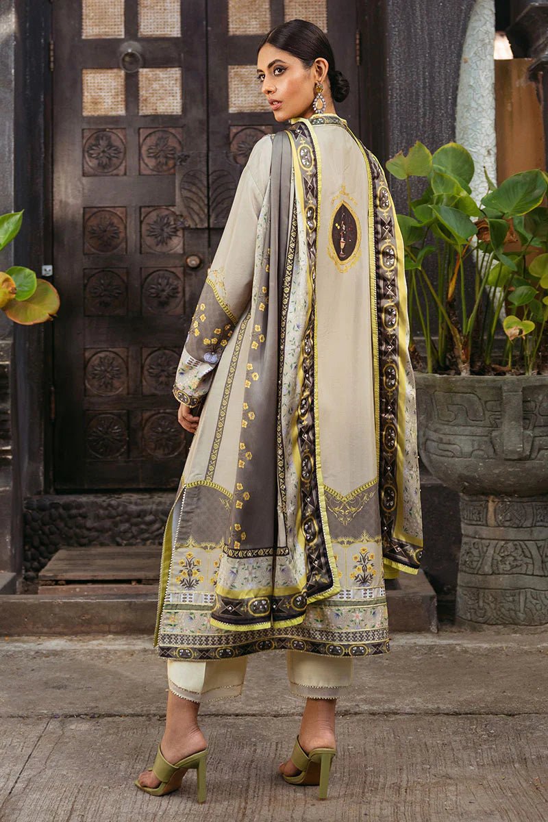 Model wearing Chestnut dress from Mushq's Nirvana Silk Edit in beige and grey tones with floral accents. Pakistani winter casual pret clothes available online in the UK.