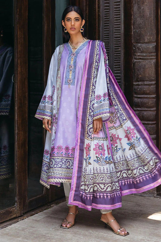 Model wearing Viola dress from Mushq's Nirvana Silk Edit, featuring a lilac and purple floral design. Pakistani winter casual pret clothes available online in the UK.