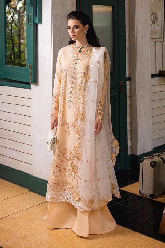 Model wearing Mushq ODYSSEY dress in cream with gold embroidery, perfect for Pakistani designer clothes in the UK.