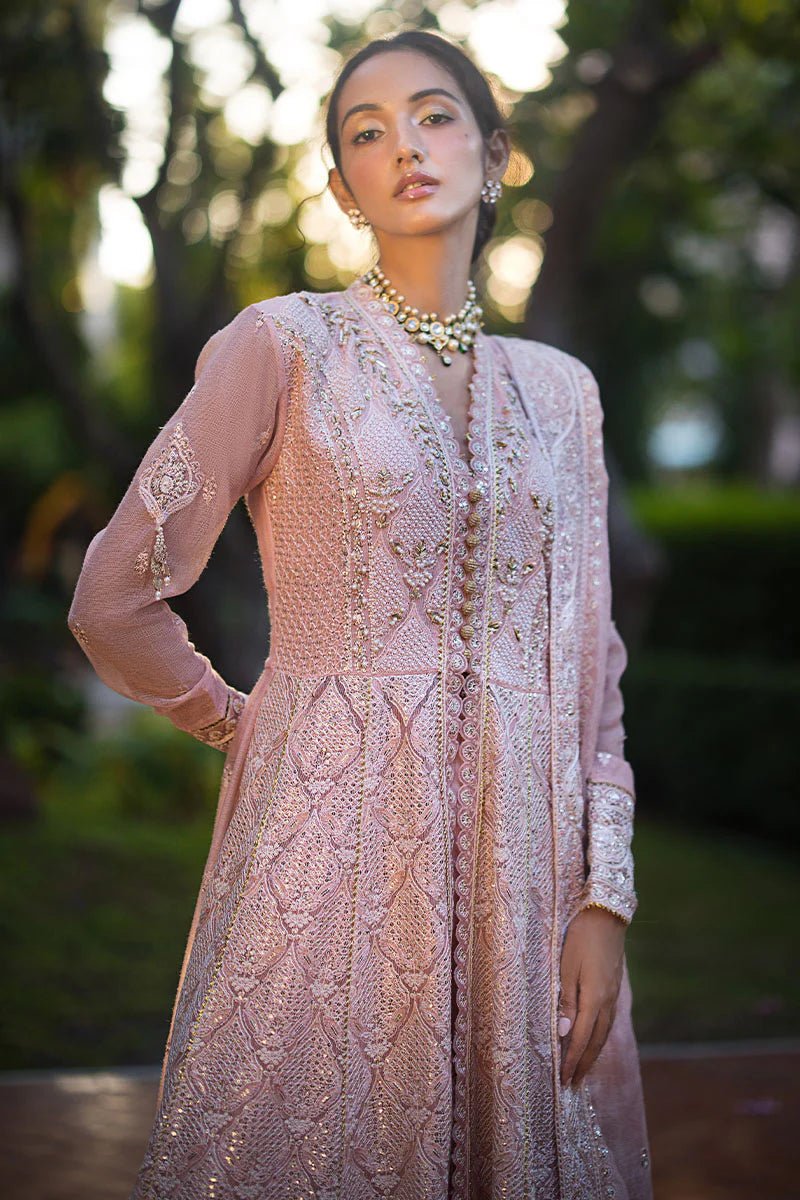 Model wearing Mushq Roohi Luxury Collection Aanya dress in blush pink, highlighting intricate embroidery. Perfect for Pakistani wedding clothes online in UK.