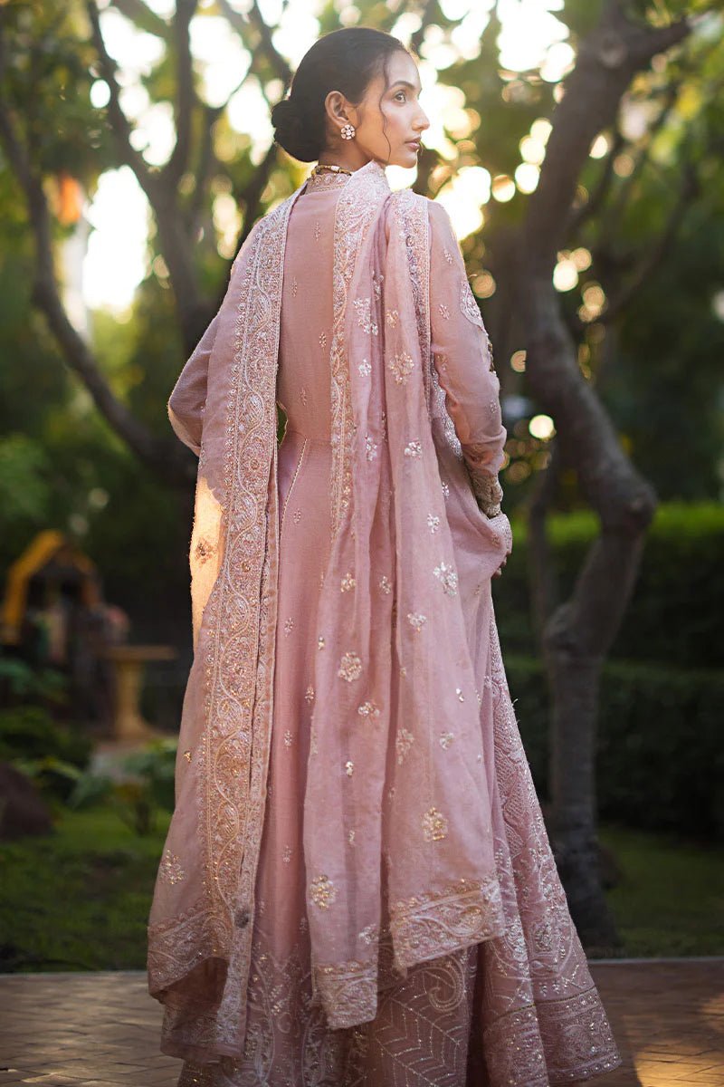 Model wearing Mushq Roohi Luxury Collection Aanya dress in blush pink, highlighting intricate embroidery. Perfect for Pakistani wedding clothes online in UK.