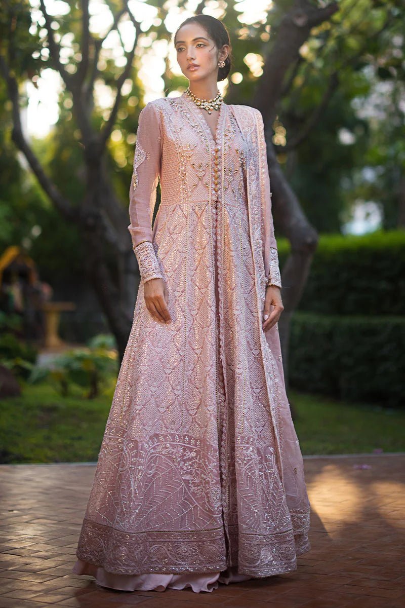 Model wearing Mushq Roohi Luxury Collection Aanya dress in blush pink, highlighting intricate embroidery. Perfect for Pakistani wedding clothes online in UK.