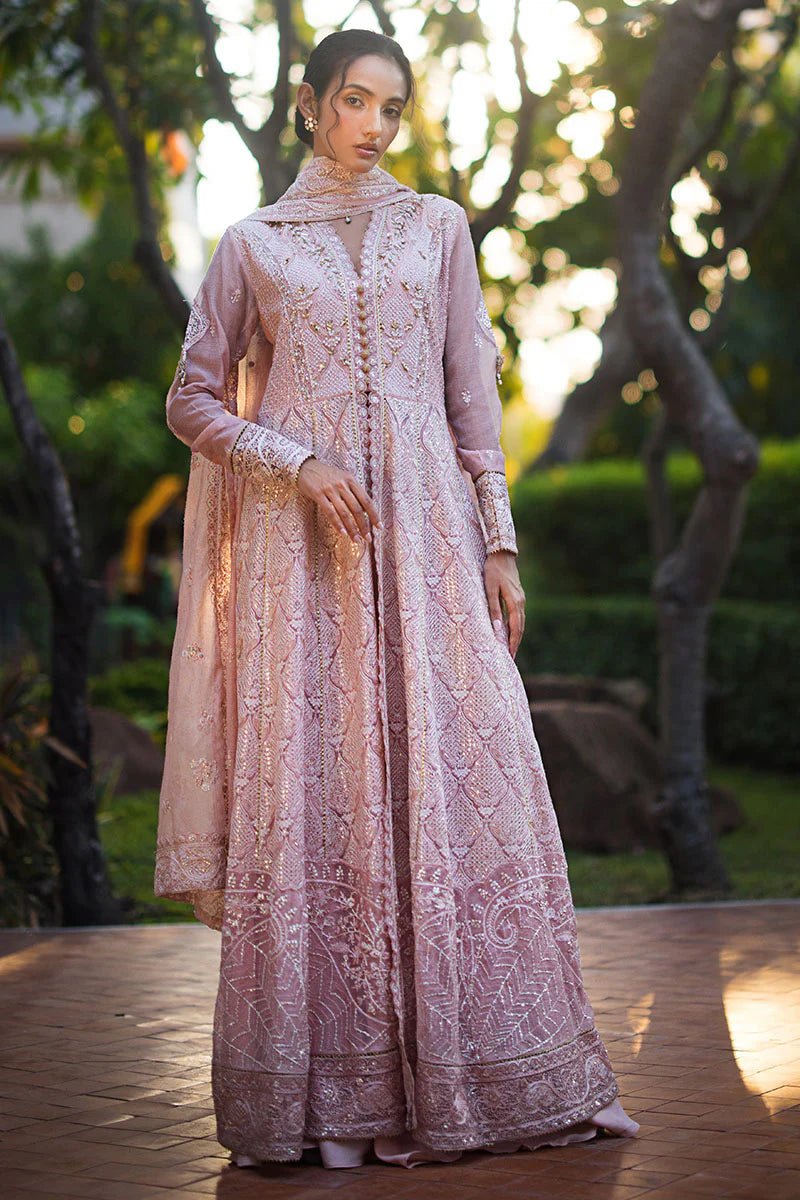 Model wearing Mushq Roohi Luxury Collection Aanya dress in blush pink, highlighting intricate embroidery. Perfect for Pakistani wedding clothes online in UK.