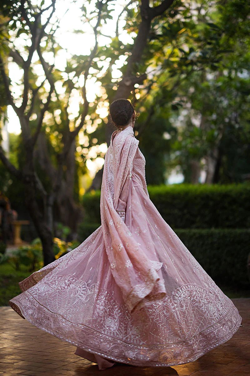 Model wearing Mushq Roohi Luxury Collection Aanya dress in blush pink, highlighting intricate embroidery. Perfect for Pakistani wedding clothes online in UK.