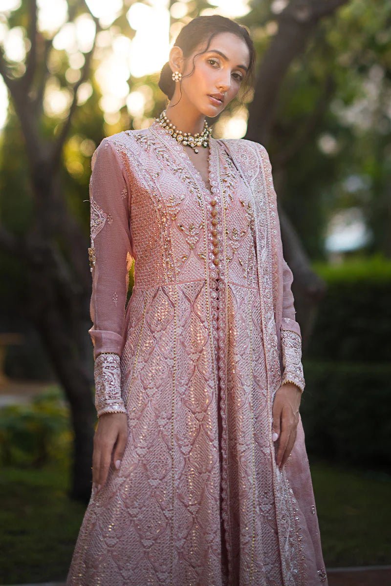 Model wearing Mushq Roohi Luxury Collection Aanya dress in blush pink, highlighting intricate embroidery. Perfect for Pakistani wedding clothes online in UK.