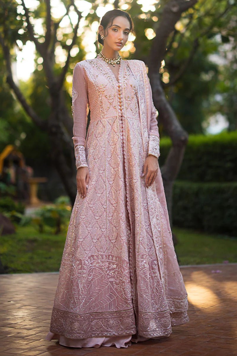 Model wearing Mushq Roohi Luxury Collection Aanya dress in blush pink, highlighting intricate embroidery. Perfect for Pakistani wedding clothes online in UK.