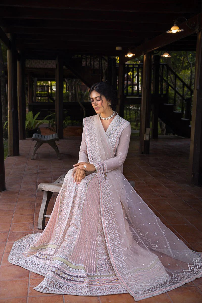 Model wearing a pale pink dress from Mushq's Roohi Luxury Collection, Anika. Perfect for Pakistani wedding clothes online in the UK.