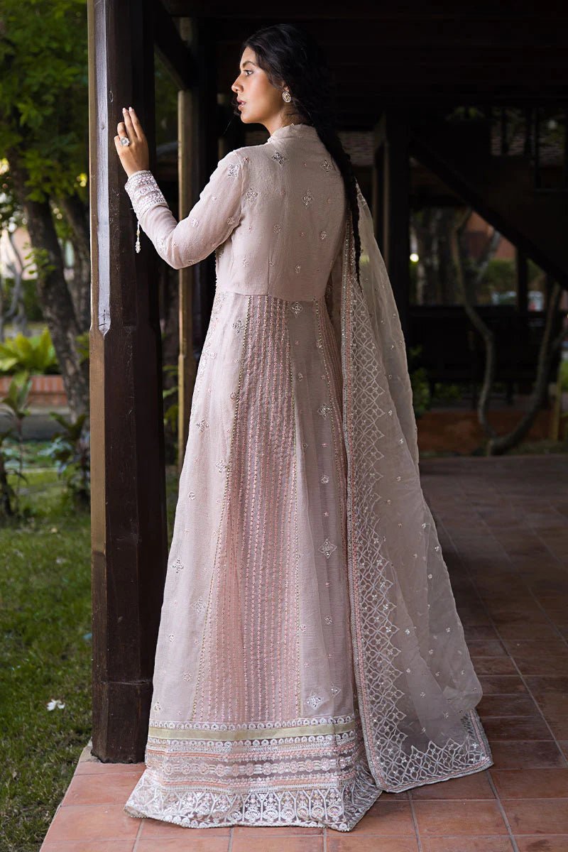 Model wearing a pale pink dress from Mushq's Roohi Luxury Collection, Anika. Perfect for Pakistani wedding clothes online in the UK.