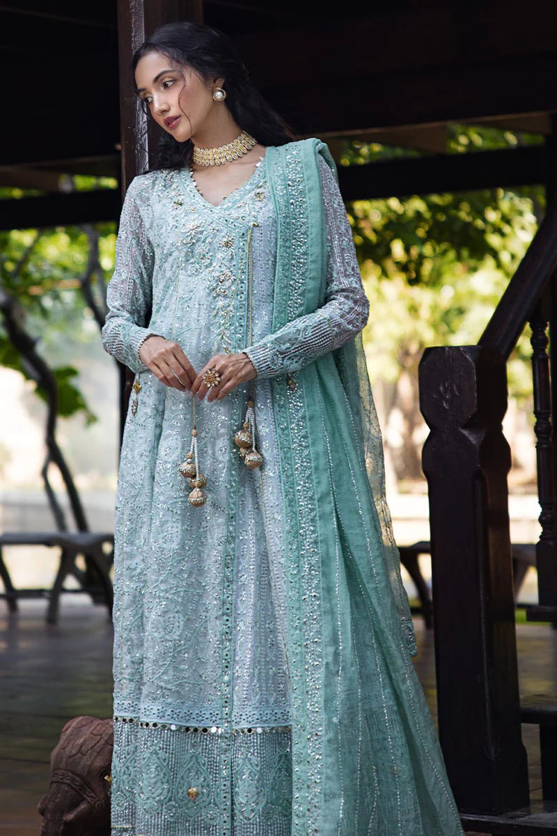 Model wearing a pastel green embroidered Diya dress from Mushq's Roohi Luxury Collection. Perfect for Pakistani clothes online in UK and wedding attire.