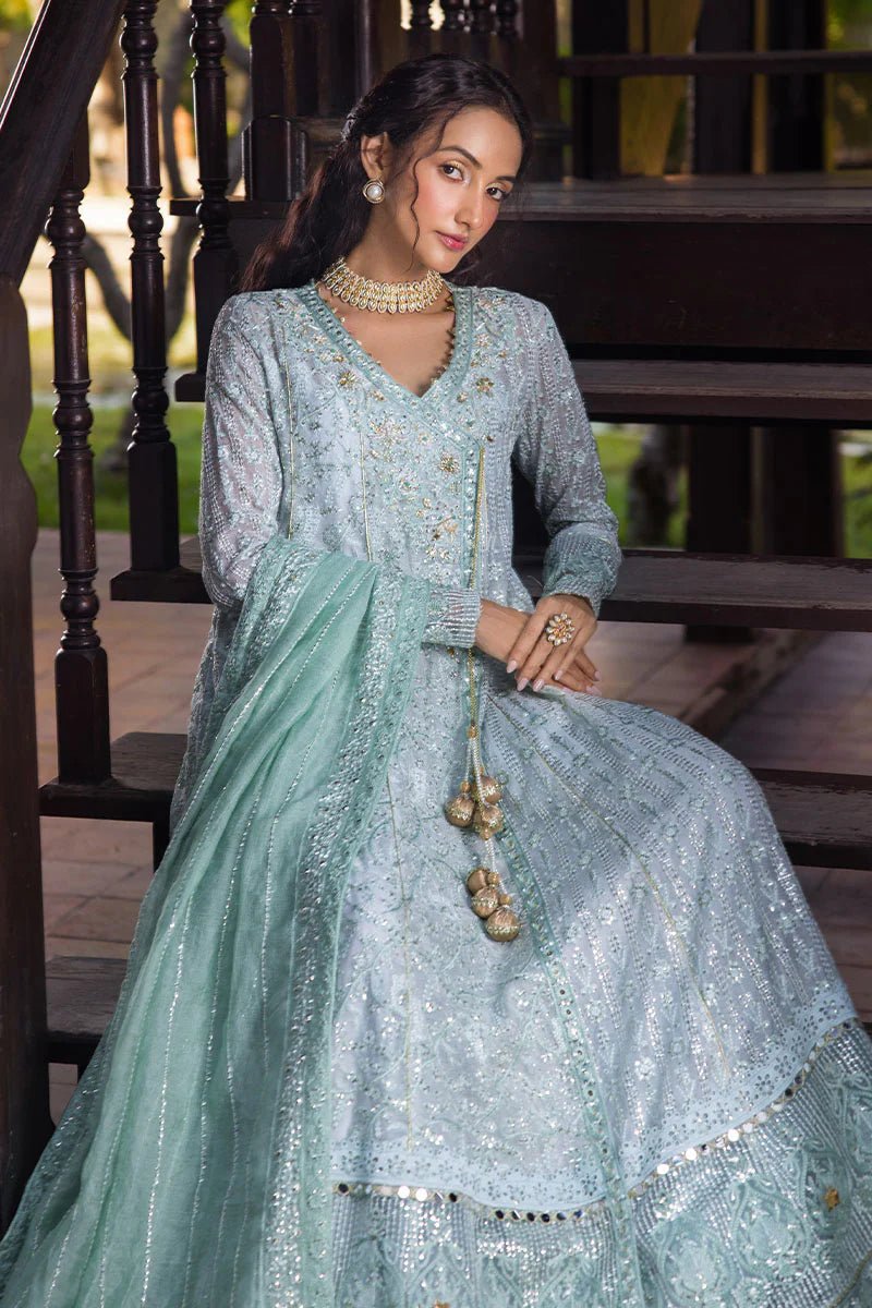 Model wearing a pastel green embroidered Diya dress from Mushq's Roohi Luxury Collection. Perfect for Pakistani clothes online in UK and wedding attire.