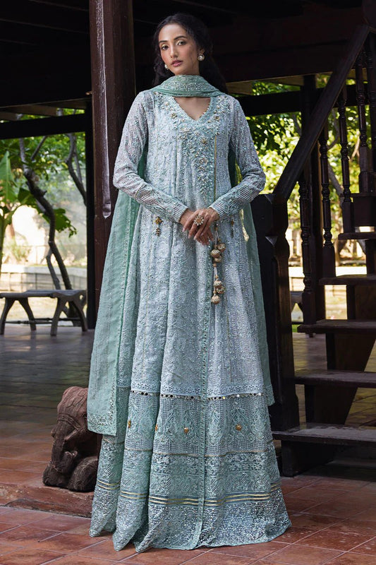 Model wearing a pastel green embroidered Diya dress from Mushq's Roohi Luxury Collection. Perfect for Pakistani clothes online in UK and wedding attire.