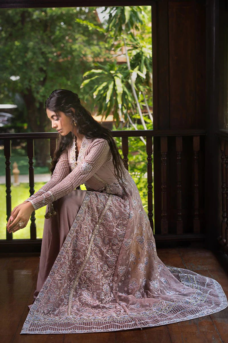 Model wearing Mushq Janvi dress in dusty pink. Shop Pakistani wedding clothes online in the UK. Discover Mushq's Roohi Luxury Collection.