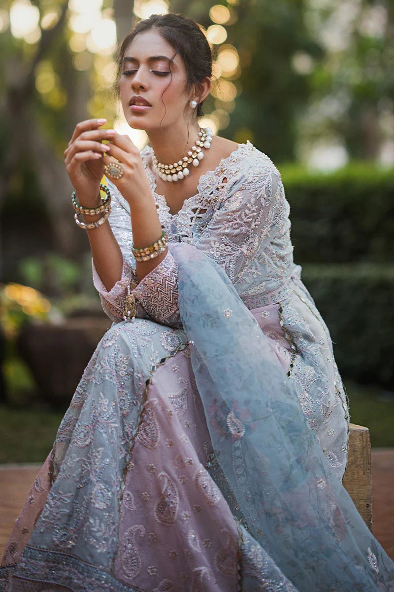 Model wearing Misha dress from Mushq, a pastel pink and blue outfit with intricate embroidery, perfect for Pakistani weddings. Available online in the UK.