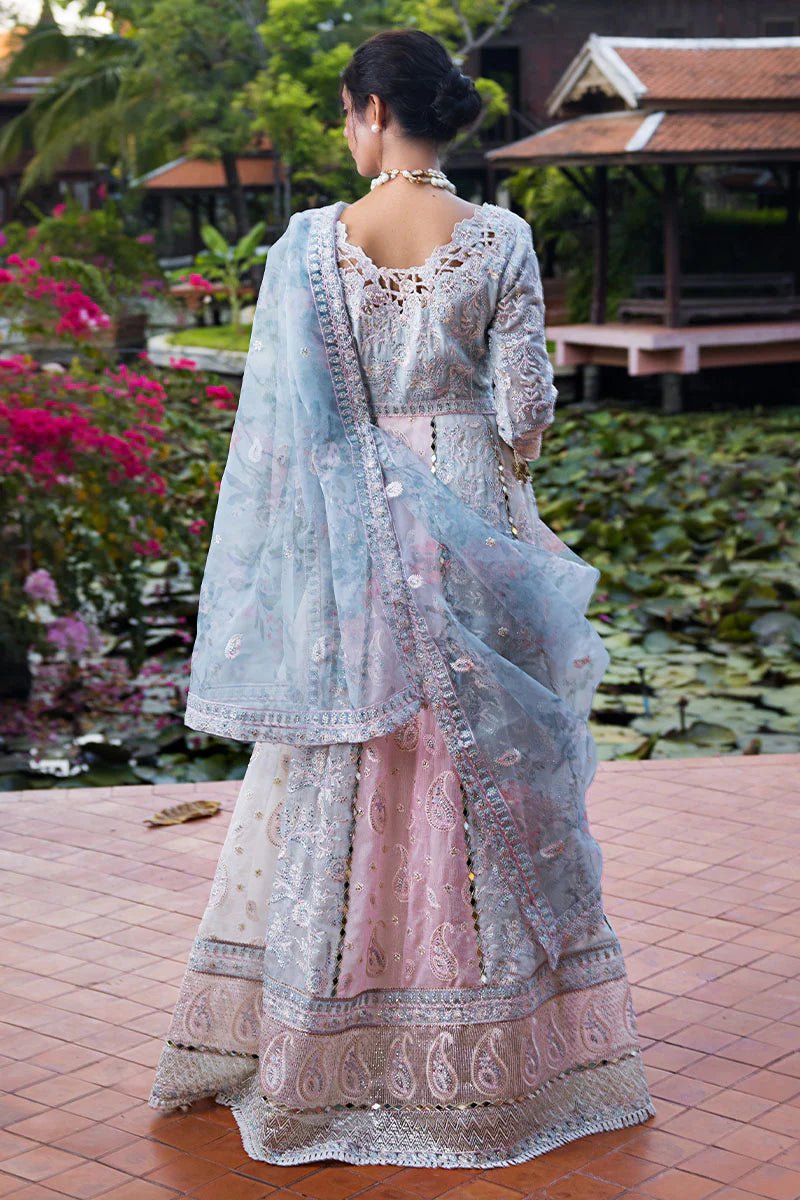 Model wearing Misha dress from Mushq, a pastel pink and blue outfit with intricate embroidery, perfect for Pakistani weddings. Available online in the UK.