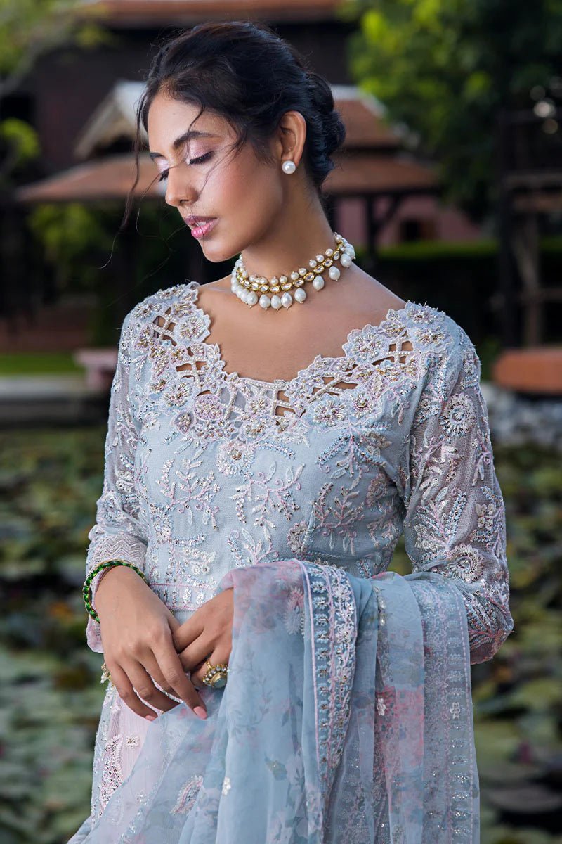 Model wearing Misha dress from Mushq, a pastel pink and blue outfit with intricate embroidery, perfect for Pakistani weddings. Available online in the UK.