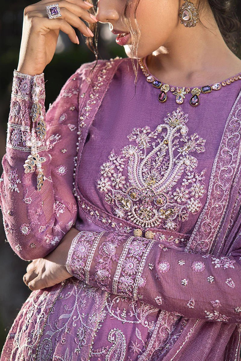 Model wearing a lavender Naina dress from Mushq's Roohi Luxury Collection. Perfect for weddings. Pakistani clothes online in UK.