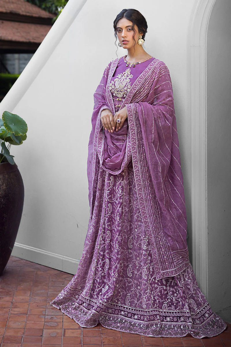 Model wearing a lavender Naina dress from Mushq's Roohi Luxury Collection. Perfect for weddings. Pakistani clothes online in UK.