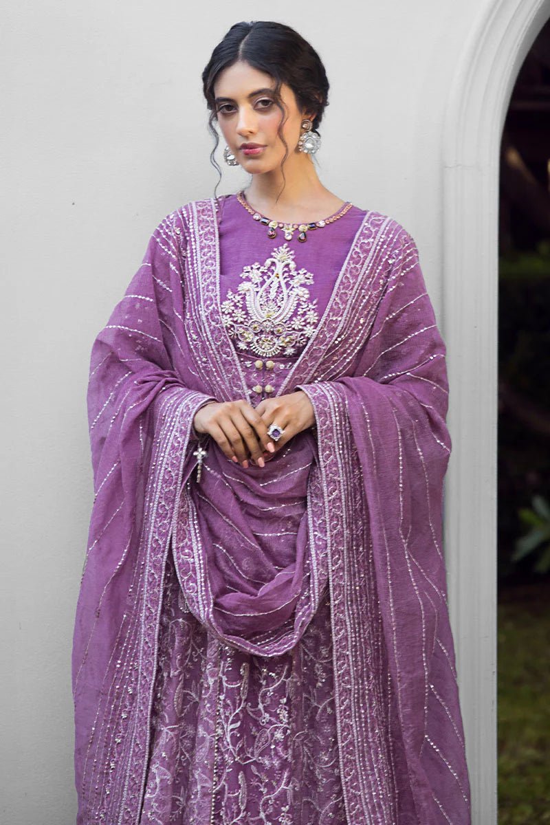 Model wearing a lavender Naina dress from Mushq's Roohi Luxury Collection. Perfect for weddings. Pakistani clothes online in UK.