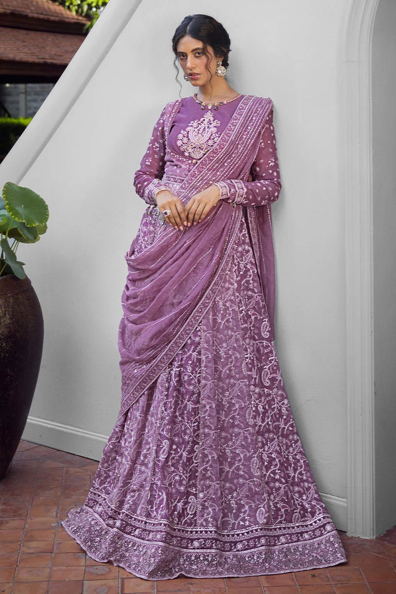 Model wearing a lavender Naina dress from Mushq's Roohi Luxury Collection. Perfect for weddings. Pakistani clothes online in UK.