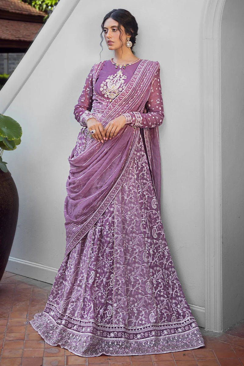 Model wearing a lavender Naina dress from Mushq's Roohi Luxury Collection. Perfect for weddings. Pakistani clothes online in UK.