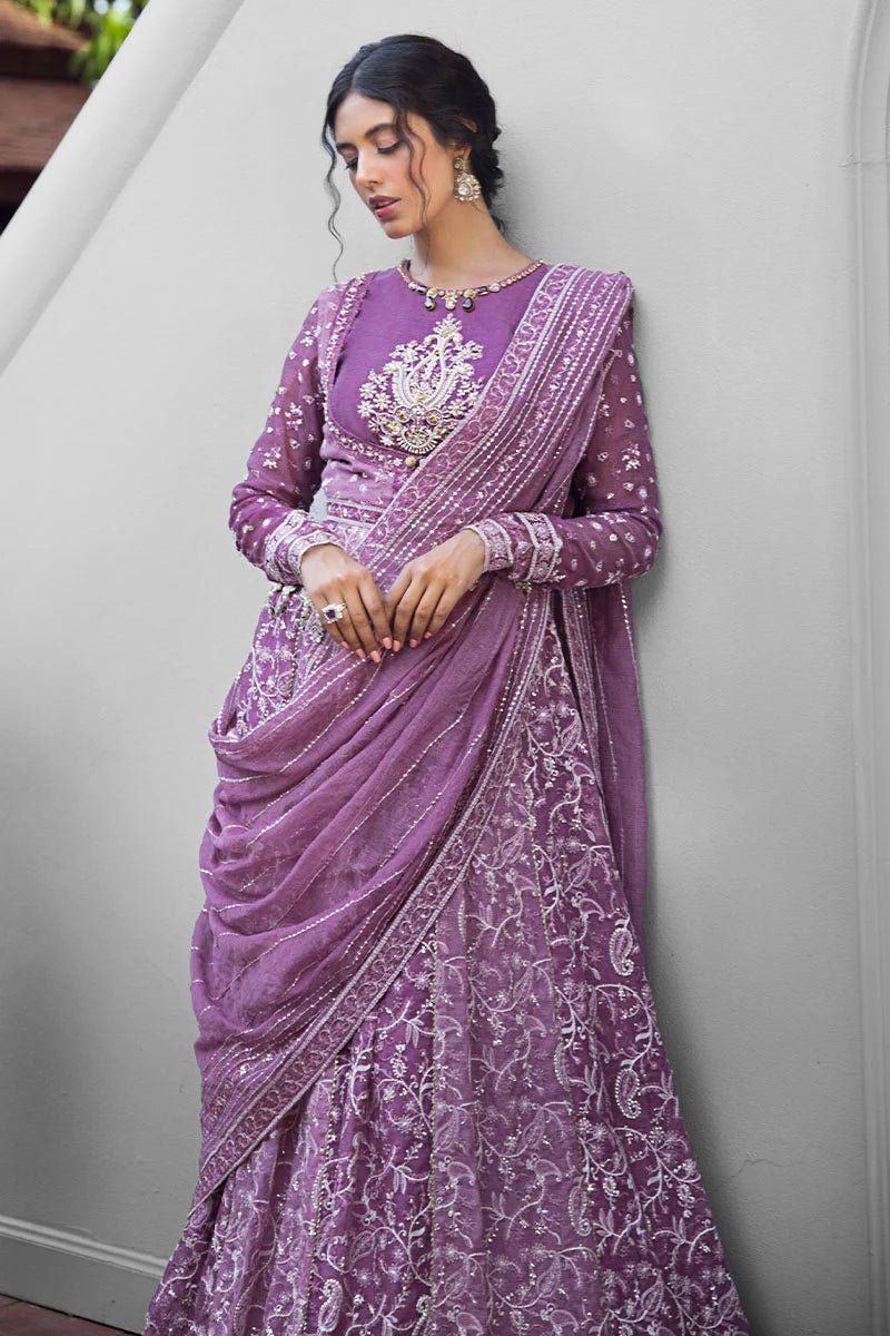 Model wearing a lavender Naina dress from Mushq's Roohi Luxury Collection. Perfect for weddings. Pakistani clothes online in UK.