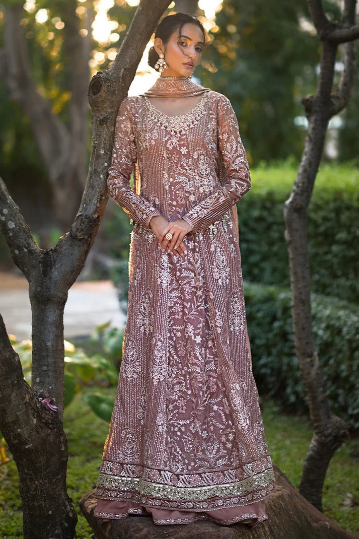 Model wearing a dusty pink Mushq Vaniya dress from the Roohi Luxury Collection. Perfect for weddings. Pakistani clothes online in UK.