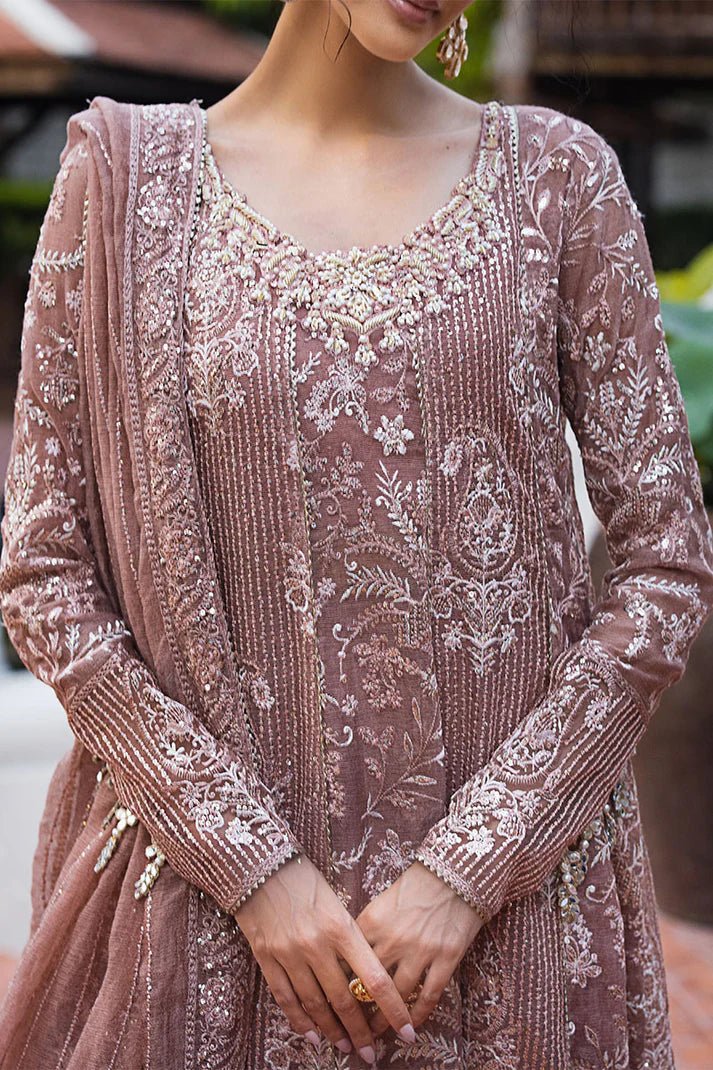 Model wearing a dusty pink Mushq Vaniya dress from the Roohi Luxury Collection. Perfect for weddings. Pakistani clothes online in UK.