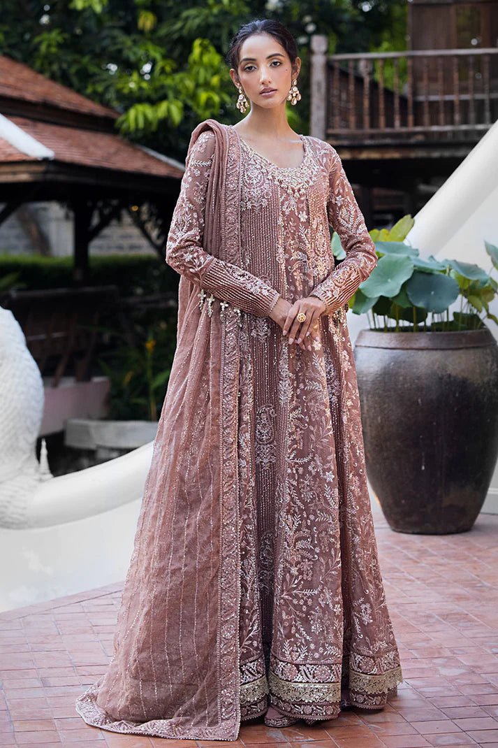 Model wearing a dusty pink Mushq Vaniya dress from the Roohi Luxury Collection. Perfect for weddings. Pakistani clothes online in UK.