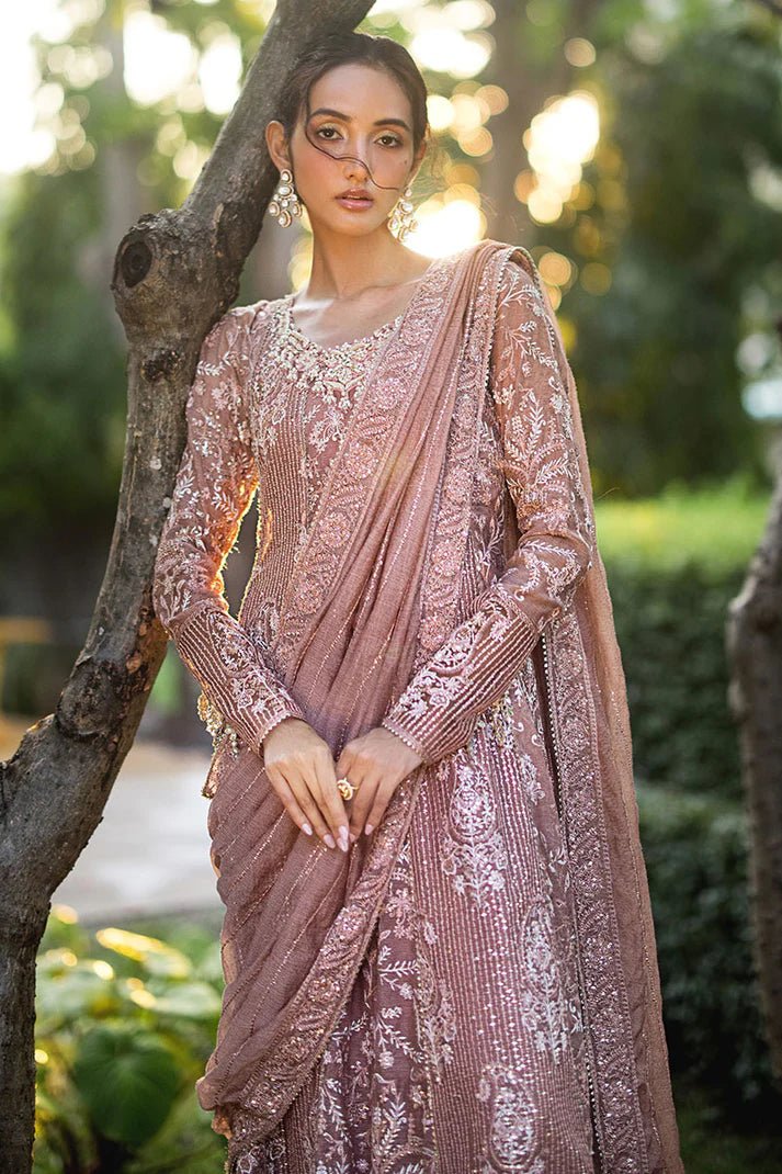 Model wearing a dusty pink Mushq Vaniya dress from the Roohi Luxury Collection. Perfect for weddings. Pakistani clothes online in UK.