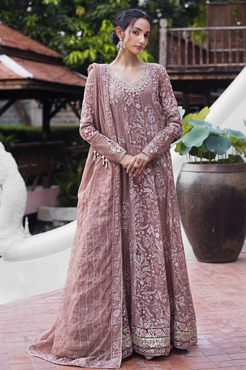 Model wearing a dusty pink Mushq Vaniya dress from the Roohi Luxury Collection. Perfect for weddings. Pakistani clothes online in UK.