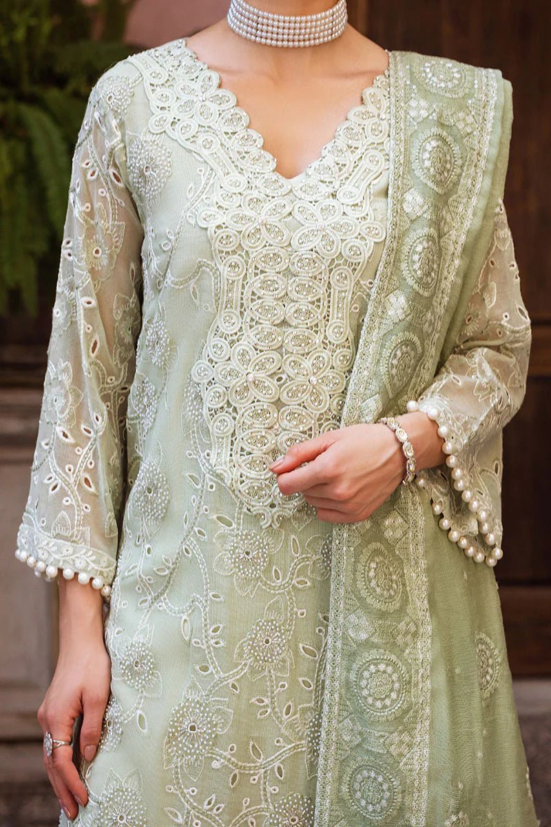 Model wearing mint green DHARA dress from Mushq, Saugaat Chickenkari Pret collection. Pakistani designer clothes in UK, readymade clothes, elegant and stylish.