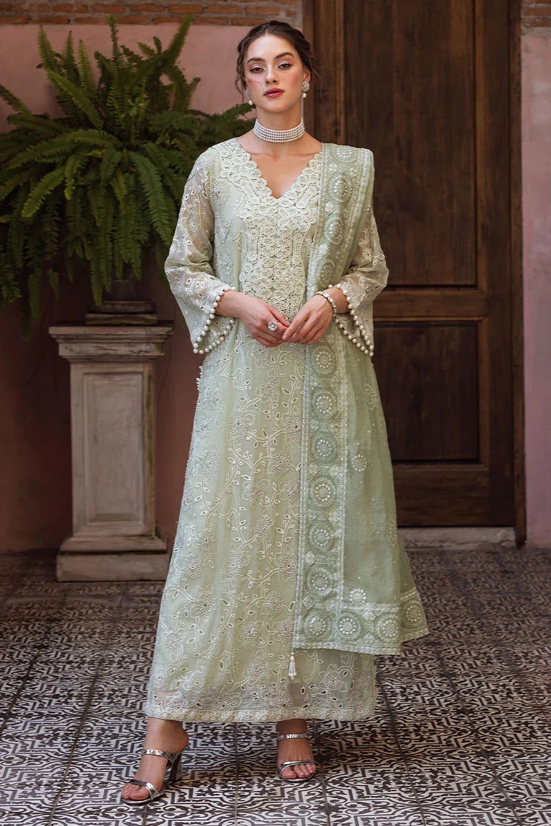 Model wearing mint green DHARA dress from Mushq, Saugaat Chickenkari Pret collection. Pakistani designer clothes in UK, readymade clothes, elegant and stylish.