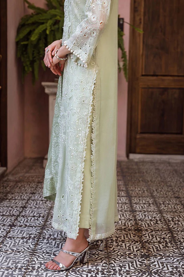 Model wearing mint green DHARA dress from Mushq, Saugaat Chickenkari Pret collection. Pakistani designer clothes in UK, readymade clothes, elegant and stylish.