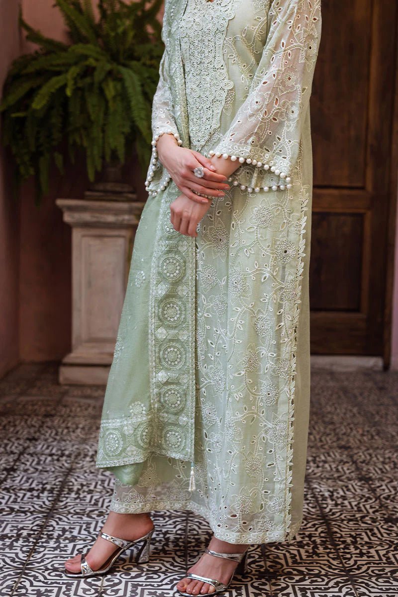 Model wearing mint green DHARA dress from Mushq, Saugaat Chickenkari Pret collection. Pakistani designer clothes in UK, readymade clothes, elegant and stylish.